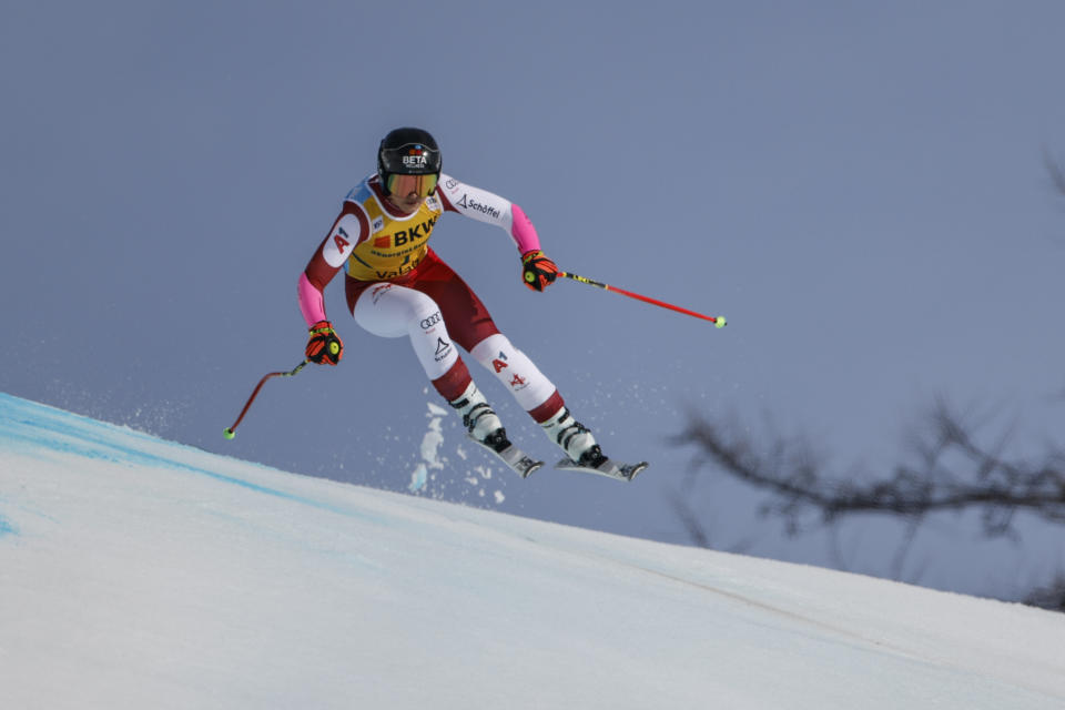 Austria's Stephanie Venier speeds down the course during an alpine ski, women's World Cup super-G, in Crans Montana, Switzerland, Sunday, Feb. 18, 2024. (AP Photo/Giovanni Maria Pizzato)