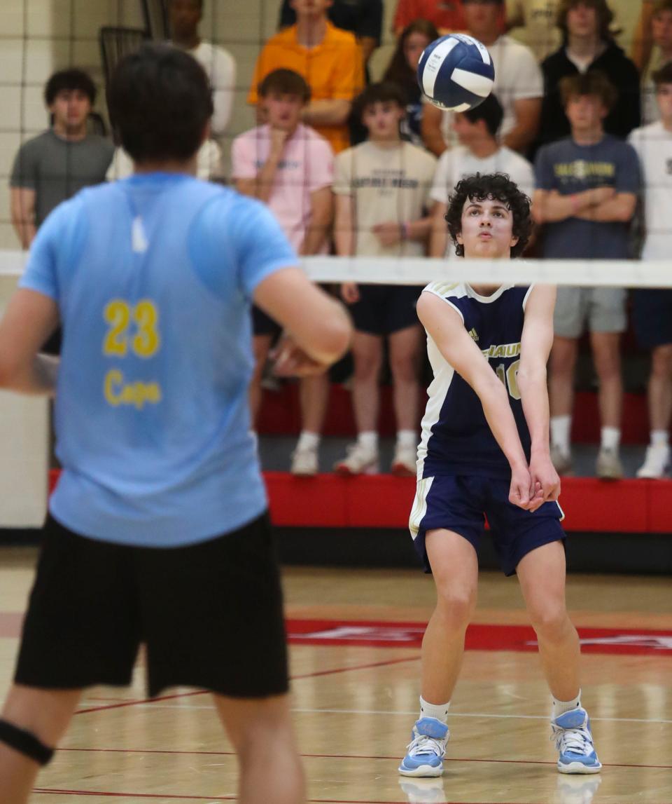 Salesianum's Andrew Mahoney (right) digs in the second game of Cape Henlopen's 3-0 win for the first DIAA state title earned in boys volleyball, Tuesday, May 23, 2023 at Smyrna High School.