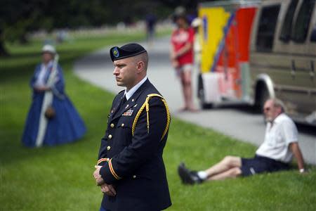 Major Jarod Parker observes the ceremony at National Soldier's Cemetery following the Gettysburg Memorial Day parade in Gettysburg, Pennsylvania, May 26, 2014. REUTERS/Mark Makela