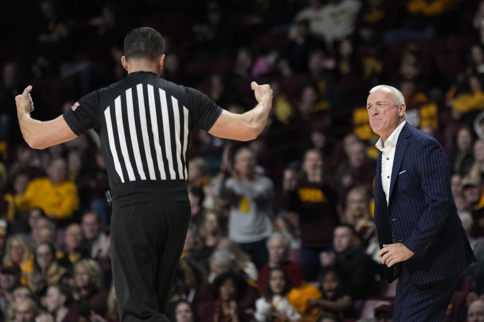 Florida Gulf Coast head coach Pat Chambers looks toward a referee during the second half of an NCAA college basketball game against Minnesota, Saturday, Dec. 9, 2023, in Minneapolis. (AP Photo/Abbie Parr)