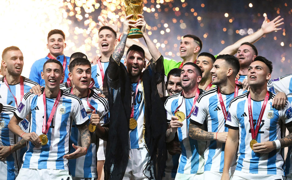 Lionel Messi, pictured here lifting the World Cup trophy alongside his Argentina teammates after the final.