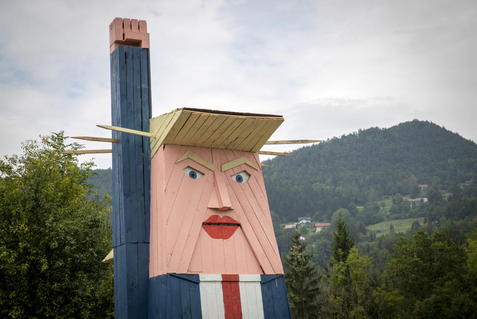 A wooden statue resembling Donald Trump is built near Kamnik, Slovenia, Friday, Aug. 30, 2019. Only weeks after Melania Trump statue was erected in her home town of Sevnica, Slovenia, another statue, now of her husband Donald, has been erected not far from there. (AP Photo/Darko Bandic)