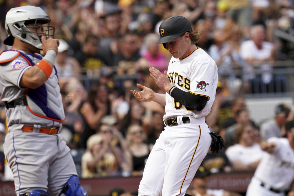 Pittsburgh Pirates' Jack Suwinski scores against the New York Mets in the fourth inning in a baseball game in Pittsburgh, Saturday, June 10, 2023. (AP Photo/Matt Freed)