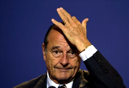 FILE PHOTO: French president Jacques Chirac attends a press conference at an European Union heads of state and g..