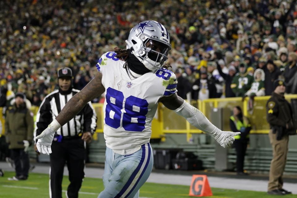 Dallas Cowboys wide receiver CeeDee Lamb (88) celebrates after catching a pass for a touchdown during the second half of an NFL football game against the Green Bay Packers Sunday, Nov. 13, 2022, in Green Bay, Wis. (AP Photo/Matt Ludtke)