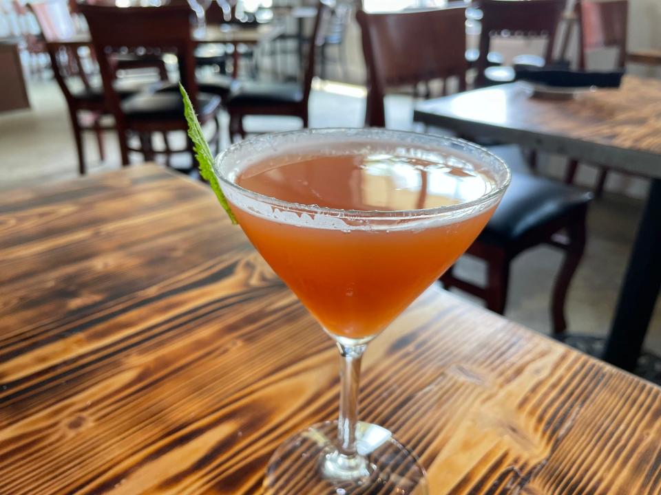 An alcohol-free cocktail made with cranberry, orange and mint at Frank & Sons Steakhouse in Athens, Ga. on Tuesday, Sept. 26, 2023.