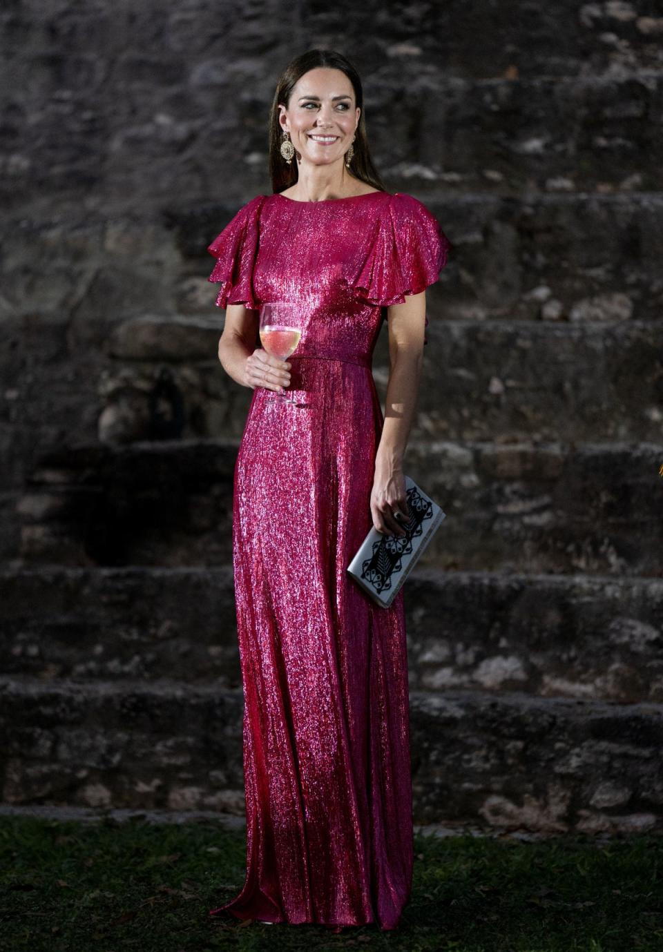 The then Duchess of Cambridge wore The Vampire’s Wife’s Light Sleeper dress, in an internet-breaking fuchsia, during a visit in Belize, 2022 (PA)