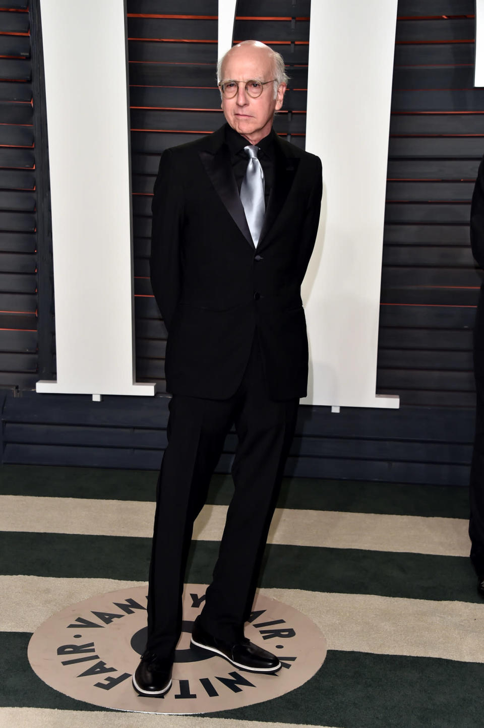 Larry David in a black suit and silver tie at the 2016 Vanity Fair Oscar Party at the Wallis Annenberg Center for the Performing Arts on February 28, 2016.