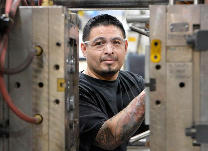 Set-up technician Jose Contreras prepares a press at Accudyn Products Inc. on Jan. 24, 2022, in Millcreek Township.