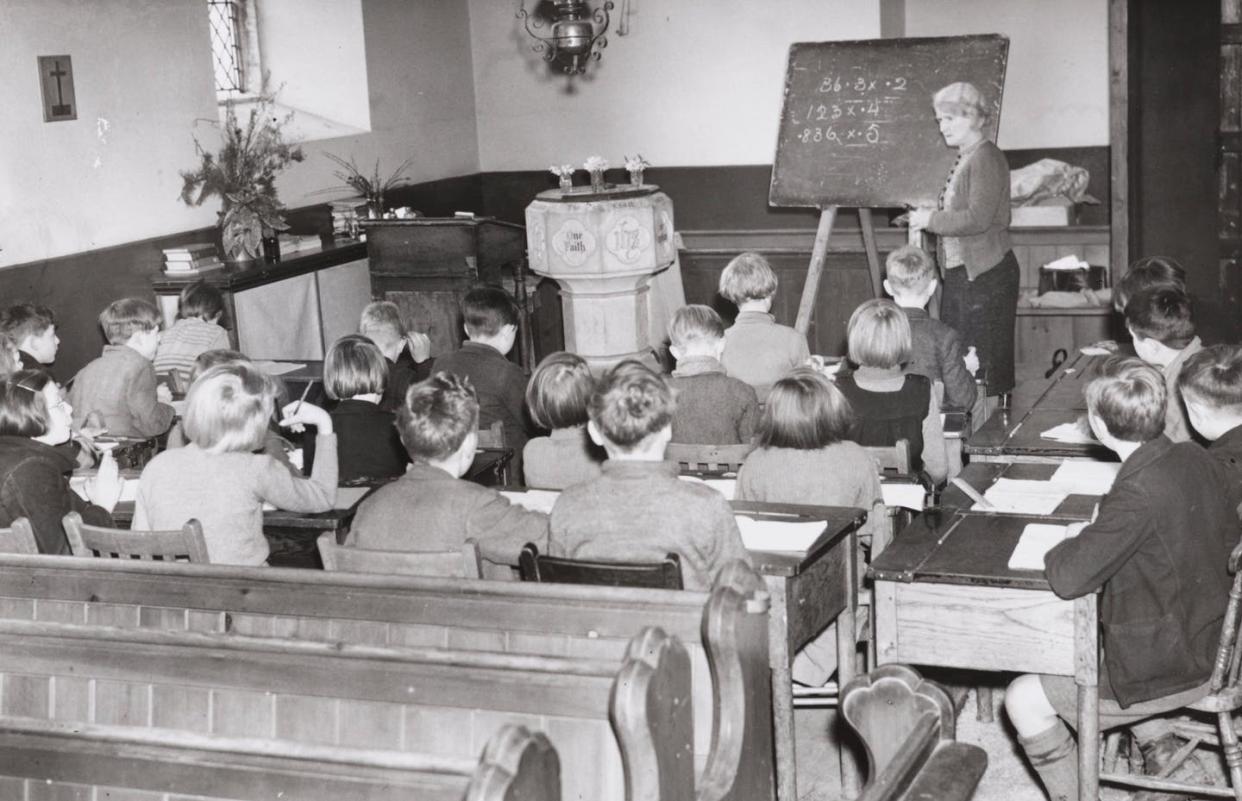 <span class="caption">Children evacuated from U.K. cities in WWII were taught in churches.</span> <span class="attribution"><a class="link " href="https://www.gettyimages.com/detail/news-photo/school-in-a-church-children-evacuated-from-west-ham-and-news-photo/1053630860?adppopup=true" rel="nofollow noopener" target="_blank" data-ylk="slk:Hulton Archive/Getty Images;elm:context_link;itc:0;sec:content-canvas">Hulton Archive/Getty Images</a></span>