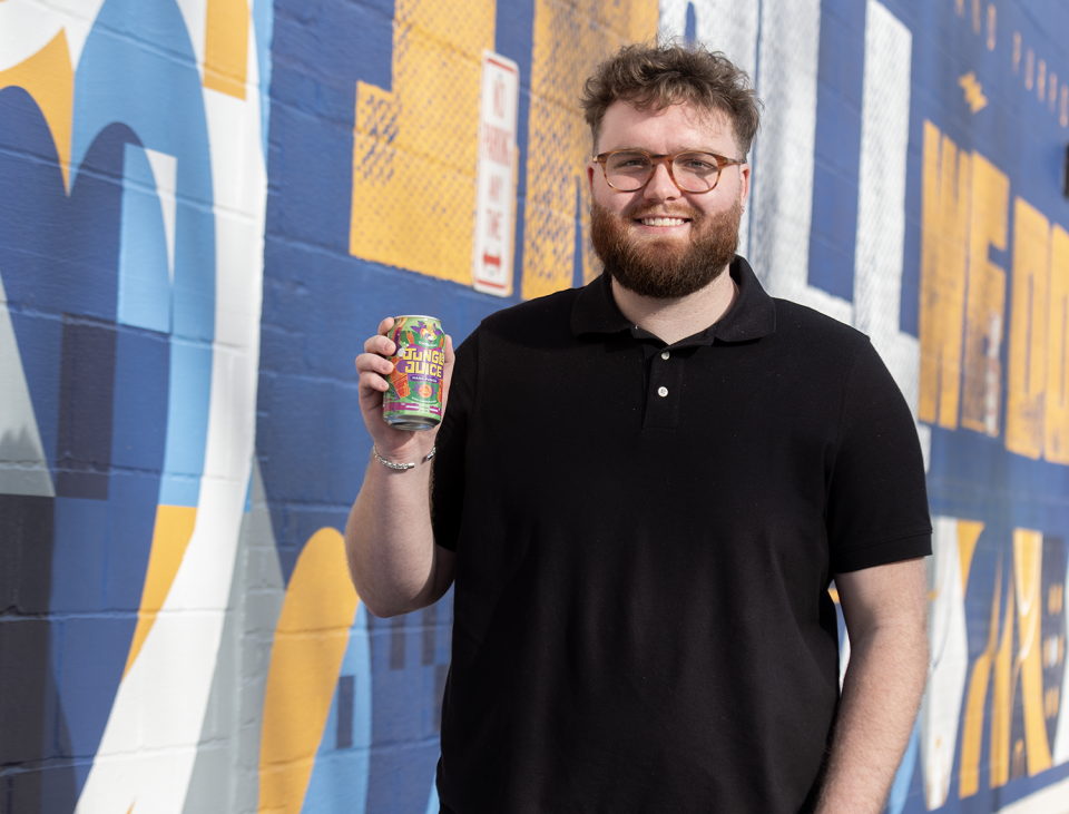 Spencer Forrest, co-founder of Jungle Juice, shows off the non-carbonated alcoholic beverage.