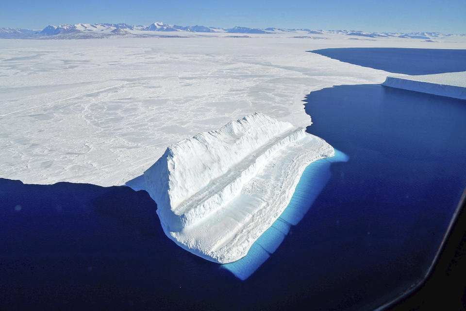 The frigid Antarctic region is an expanse of white ice and blue waters, as pictured in March, 2017, at the U.S. research facility McMurdo Station. NASA's Operation IceBridge has collected annual measurements of Antarctic ice to track changes and help predict sea level rise. (Chris Larsen/NASA via AP) / Credit: Chris Larsen / AP