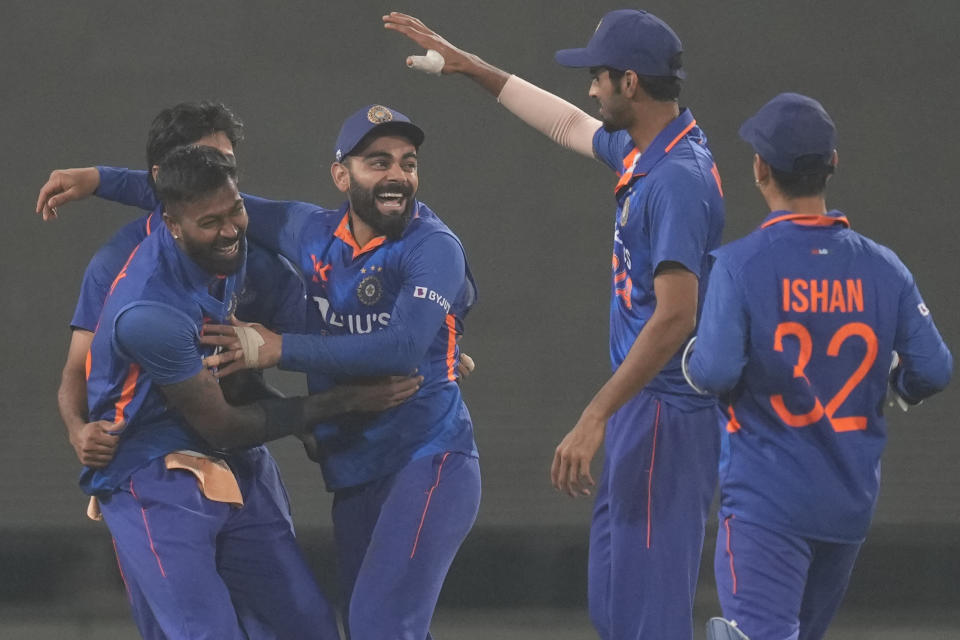 India's Virat Kohli, center celebrates after the fall of the wicket of New Zealand's captain Tom Latham along with his teammates during the third one-day international cricket match between India and New Zealand in Indore, India, Tuesday, Jan. 24, 2023. (AP Photo/Rajanish Kakade)