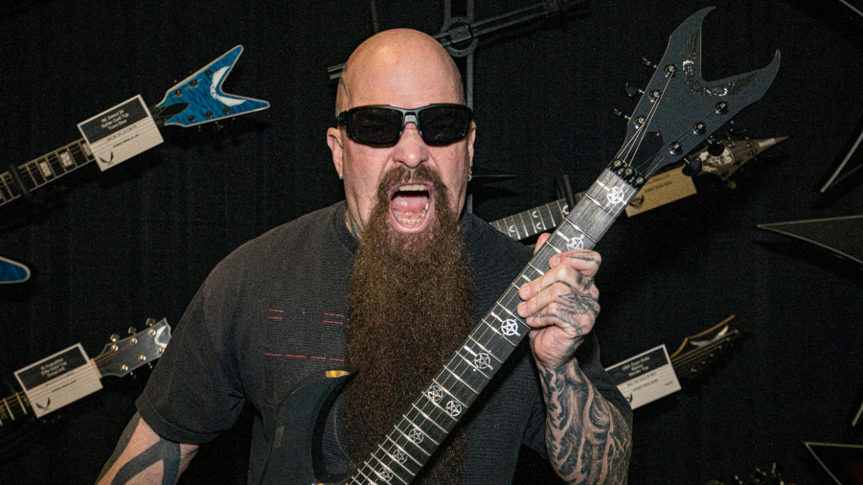  Kerry King posing with his guitar. 