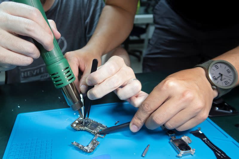 Huawei Pura 70 smartphone during a teardown, in Shenzhen