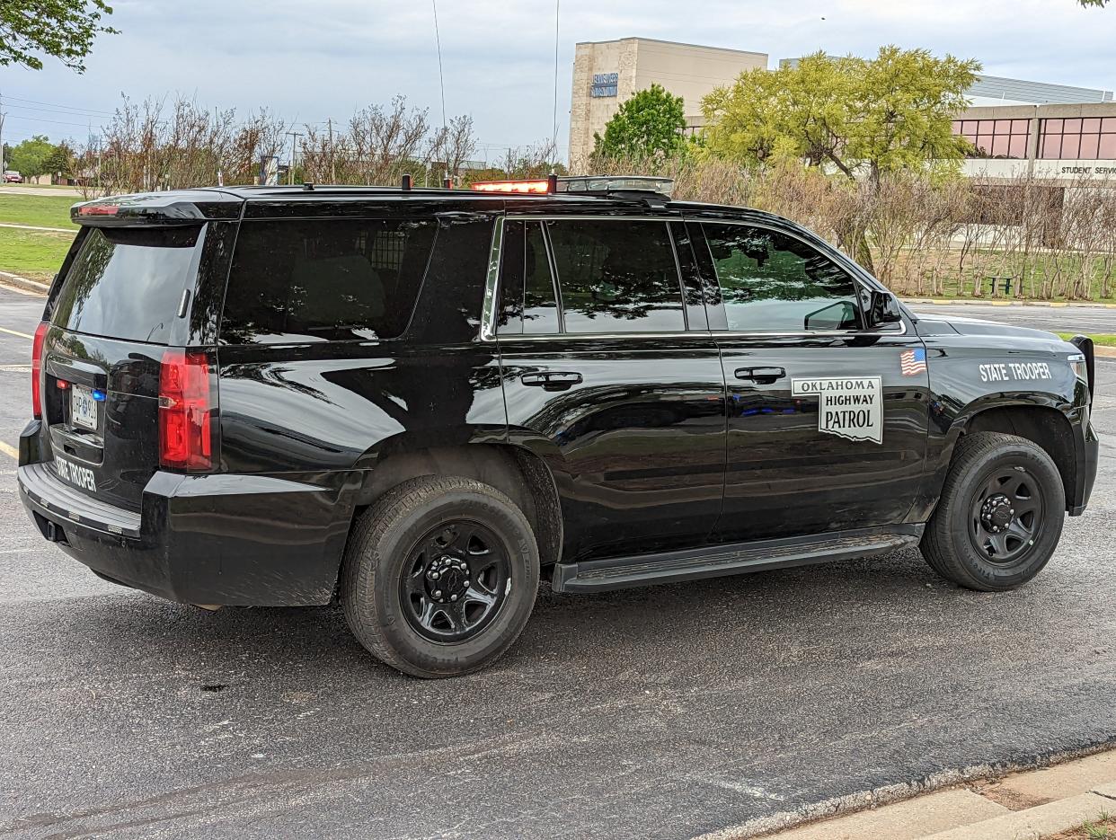 An Oklahoma Highway Patrol vehicle is seen blocking a roadway in Midwest City in April 2023.