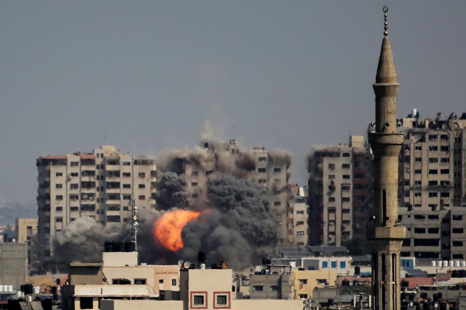 An explosion on a residential tower caused by Israeli raids in the northern Gaza Strip on October 12, 2023 in Gaza City, Gaza.