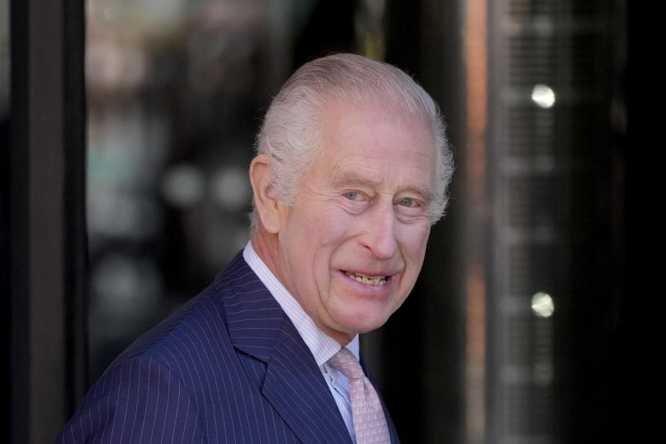 Britain's King Charles III smiles as he arrives for a visit to University College Hospital Macmillan Cancer Centre in London, Tuesday, April 30, 2024. The King, Patron of Cancer Research UK and Macmillan Cancer Support, and Queen Camilla visited the University College Hospital Macmillan Cancer Centre, meeting patients and staff. This visit is to raise awareness of the importance of early diagnosis and will highlight some of the innovative research, supported by Cancer Research UK, which is taking place at the hospital. (AP Photo/Kin Cheung)
