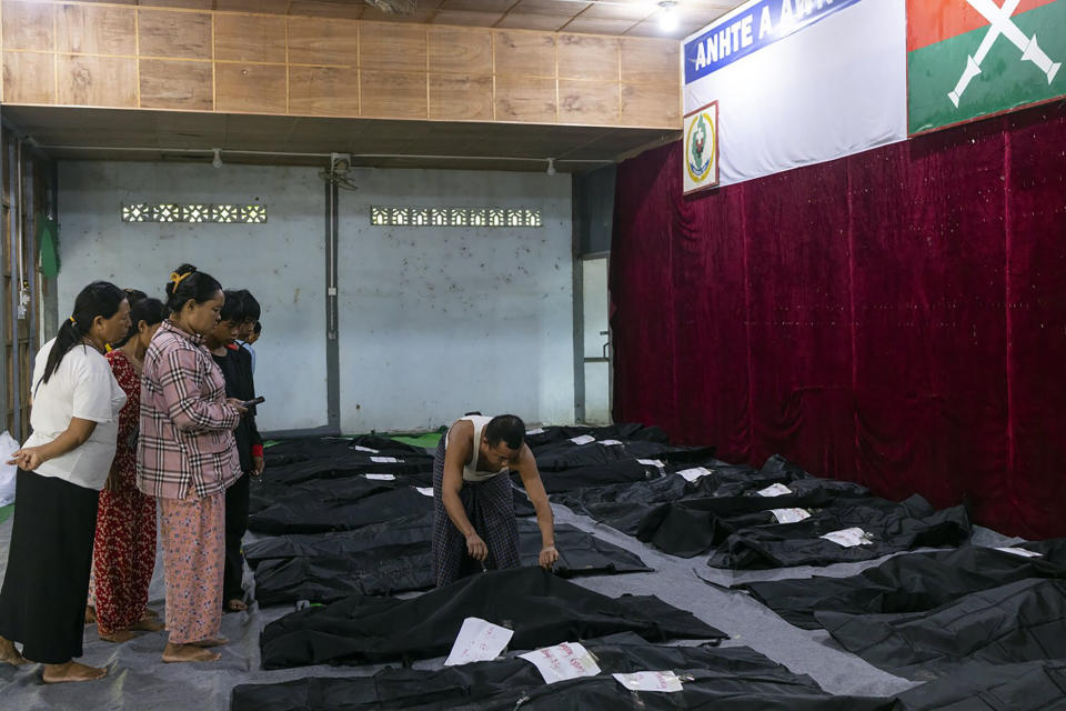 Family members check the bodies of relatives before being buried at a hospital in the town of Laiza, Myanmar, Tuesday Oct. 10, 2023. Myanmar’s military is accused of launching an airstrike on a camp for displaced persons in the northern state of Kachin that killed about 30 people, including about a dozen children. A local Kachin human rights group said the attack on the Mung Lai Hkyet displacement camp in the northern part of Laiza, a town where the headquarters of the rebel Kachin Independence Army is based, also wounded about 60 people. (AP Photo)