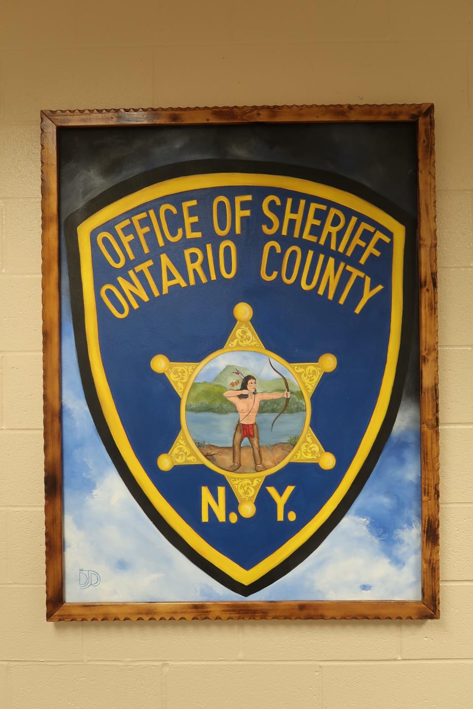 Painting of the Ontario County Sheriff's Office seal inside the county jail complex in Hopewell.