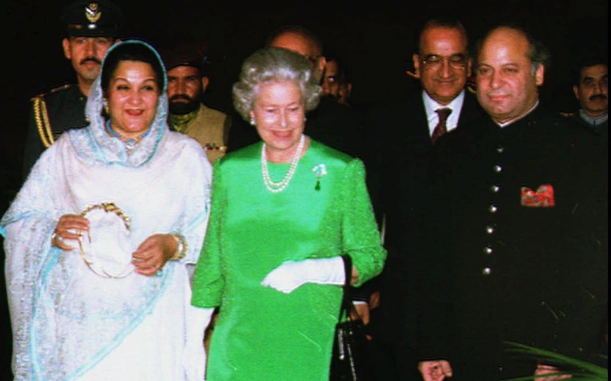 The Queen arrives alongside Nawaz Sharif and his wife Kulsoom during a visit to Pakistan in 1997 - AP