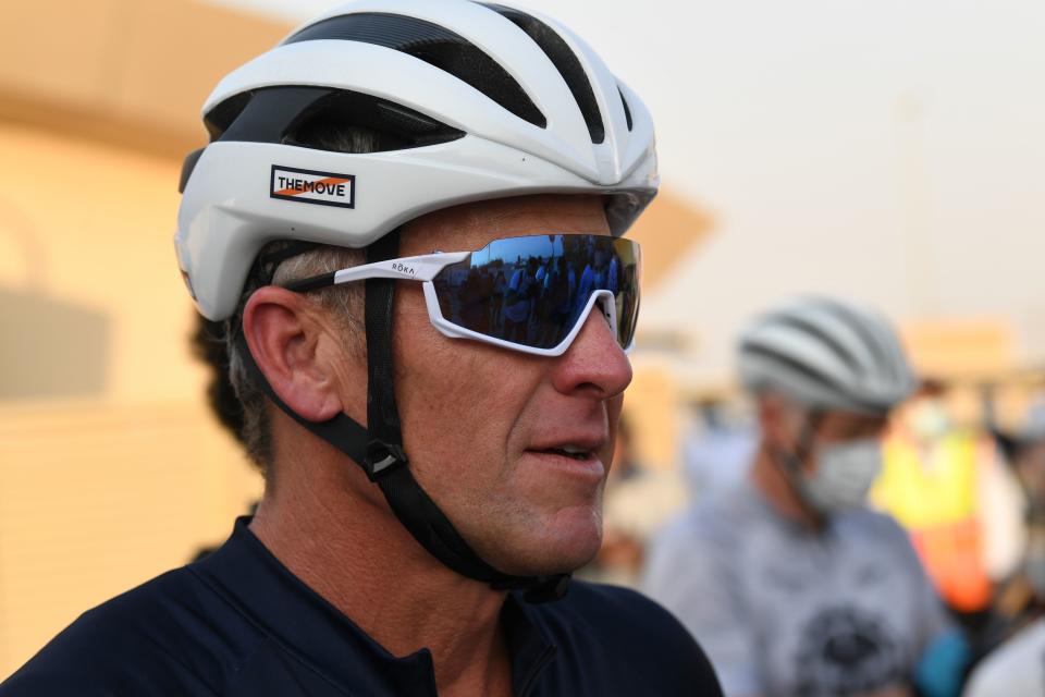 US former professional cyclist Lance Armstrong stands as he prepares to ride with Dubai cyclists at the al-Qudra Cycling Tracks in Dubai desert on October 6, 2020 during for a four-day work trip to the Emirates. (Photo by Karim SAHIB / AFP) (Photo by KARIM SAHIB/AFP via Getty Images)