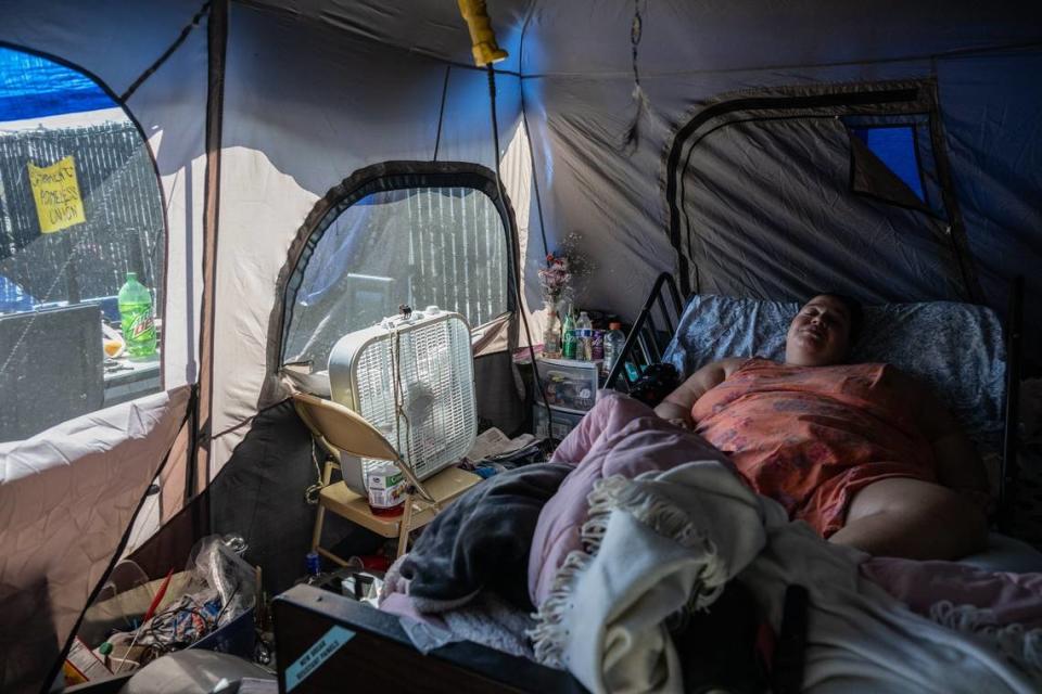 Trying to catch a breeze from a fan inside her tent, functionally quadriplegic Camp Resolution resident Holly Porter said she felt too ill to attend a Tuesday press conference asking the city of Sacramento to adhere to an agreement it made to find her housing. The agreement, signed on March 24, promised housing for Porter in 45 days, a timeline that as passed.