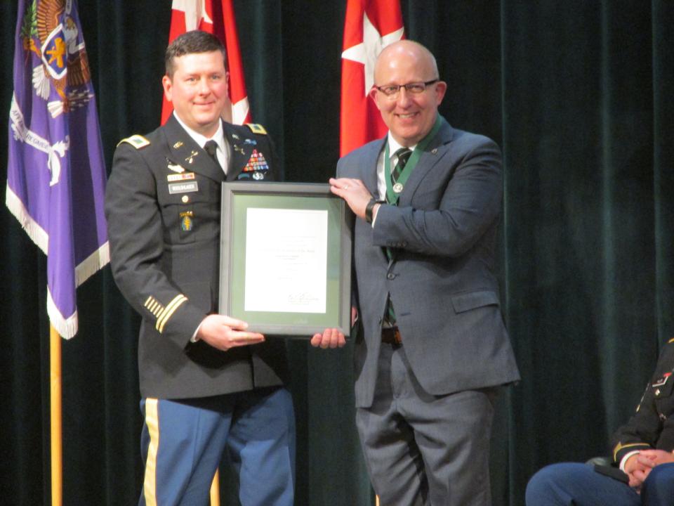 Retired Col. Mark Mitchell is inducted as a distinguished member of the Special Forces Regiment during a ceremony Thursday, April 20, 2023, at Fort Bragg.