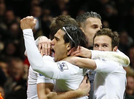 Manchester United's Radamel Falcao (C) celebrates with team-mates after scoring a goal during their English Premier League soccer match against Aston Villa at Villa Park in Birmingham, central England December 20, 2014. REUTERS/Darren Staples