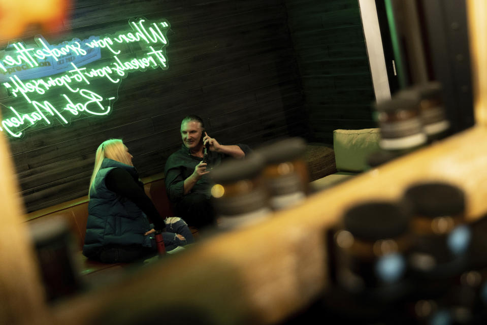 Jonathan and Lenore Elfand, two of the owners of Empire Cannabis Club, talk at the club, Wednesday, Nov. 16, 2022, in New York. Under pressure to launch one of the nation’s most hotly anticipated legal marijuana markets, the state Cannabis Control Board is set Monday to consider awarding some dispensary licenses to entrepreneurs and nonprofit groups — a major step that comes as cannabis regulators stress that they're trying to stop unlicensed sellers. (AP Photo/Julia Nikhinson)