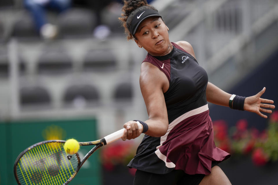 Japan's Naomi Osaka returns the ball to Ukraine's Marta Kostyuk at the Italian Open tennis tournament, in Rome, Thursday, May 9, 2024. (AP Photo/Andrew Medichini)