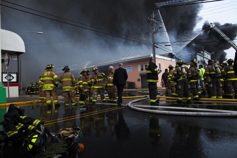 New Jersey firefighters arrive to control a massive fire in Seaside Park in New Jersey September 12, 2013. The fast-moving fire that started in a custard shop raged through several blocks of boardwalk and businesses on Thursday in Seaside Park, a shore town that was still rebuilding from damage caused by Superstorm Sandy. (REUTERS/Eduardo Munoz)