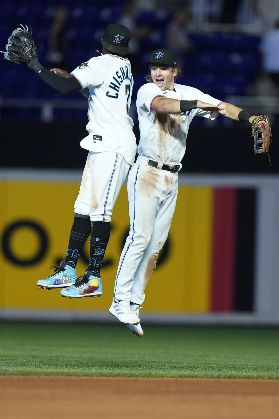 Miami Marlins second baseman Jazz Chisholm Jr., left, and right fielder Luke Williams celebrate after the Marlins beat the Colorado Rockies 3-2 during a baseball game, Thursday, June 23, 2022, in Miami. (AP Photo/Wilfredo Lee)