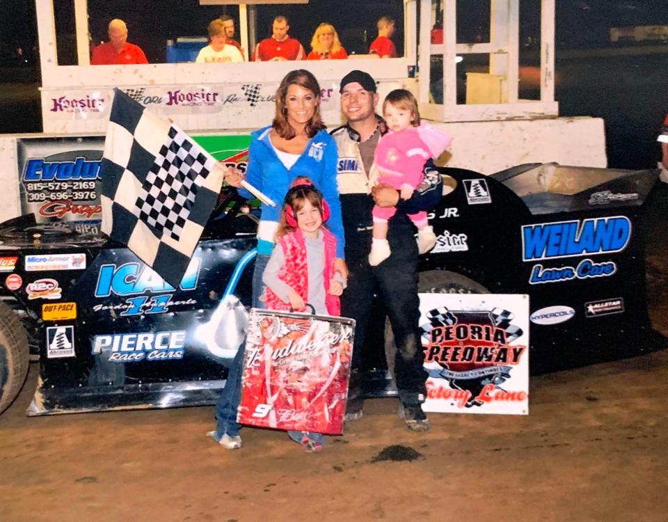 Brad Willis Jr. holds his daughter, Rhyan, after a successful outing at Peoria Speedway in 2011.