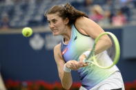 Rebecca Marino, of Canada, returns the ball to Qinwen Zheng, of China, during the National Bank Open tennis tournament in Toronto, on Tuesday, Aug. 9, 2022. (Christopher Katsarov/The Canadian Press via AP)