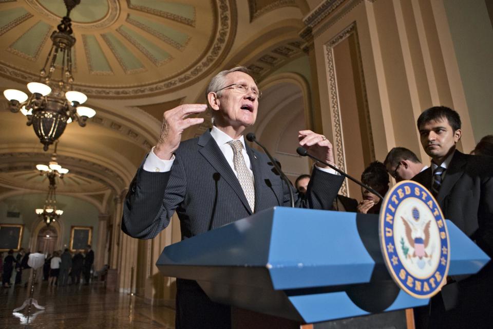 Senate Majority Leader Harry Reid of Nev. gestures as he speaks with reporters on Capitol Hill in Washington, Tuesday, July 23, 2013, following a caucus with Senate Democrats. (AP Photo/J. Scott Applewhite)