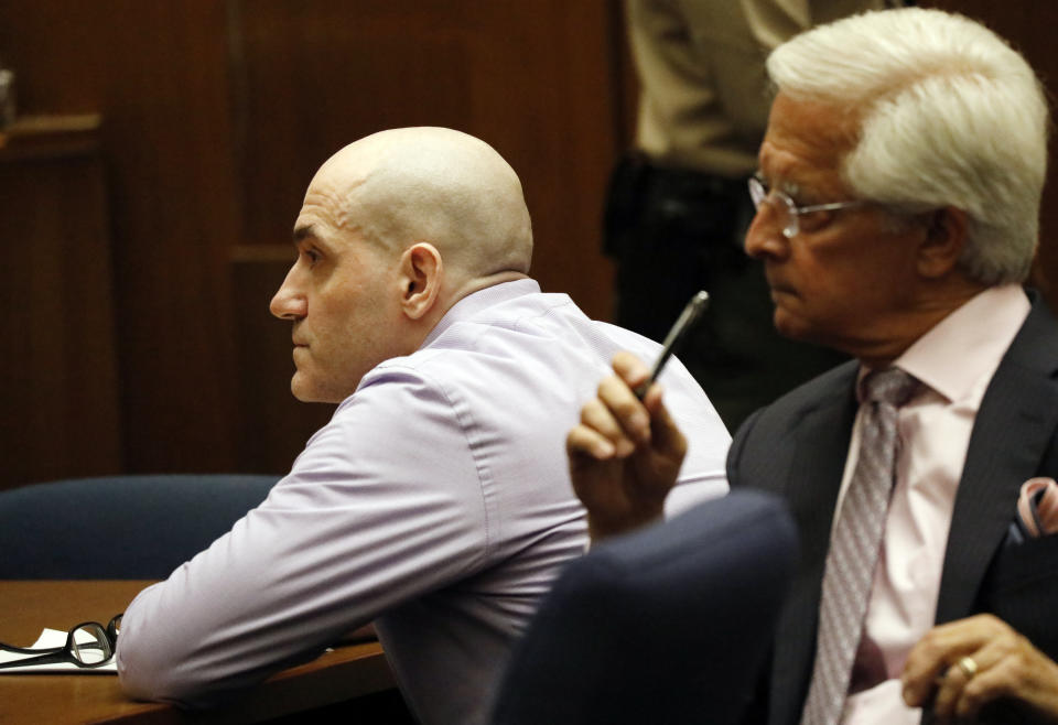 Michael Gargiulo, and his attorney Daniel Nardoni, listen as his guilty verdicts on all counts are read in Los Angeles Superior Court Thursday, Aug. 15, 2019. A jury found Gargiulo guilty of fatally stabbing two women and attempting to kill a third in their Southern California homes. Gargiulo, is also awaiting trial for a similar killing in Illinois in 1993. (Al Seib/Los Angeles Times via AP, Pool)