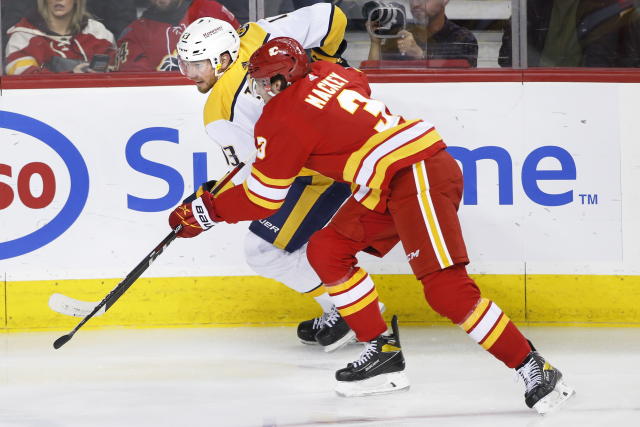 Calgary Flames goalie Jacob Markstrom makes a save against the Tampa Bay  Lightning during the second period of an NHL hockey game Thursday, March  10, 2022, in Calgary, Alberta. (Larry MacDougal/The Canadian