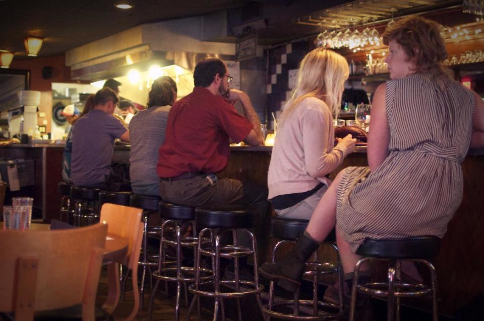 This undated image released by The Admiral restaurant shows patrons sitting at the bar of the restaurant in Asheville, N.C. Since opening in 2007, The Admiral has morphed from a neighborhood tavern into a destination restaurant. (AP Photo/The Admiral, Melissa Robinson)