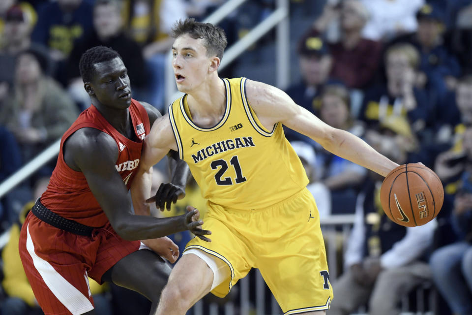 Michigan guard Franz Wagner, right, tries to get around Nebraska forward Akol Arop during the first half of an NCAA college basketball game Thursday, March 5, 2020, in Ann Arbor, Mich. (AP Photo/Jose Juarez)