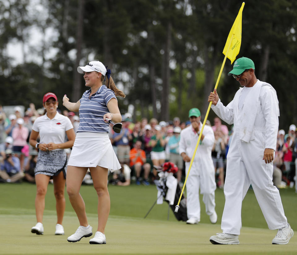 FILE - In this April 6, 2019, file photo, Jennifer Kupcho, second from left, celebrates after sinking a putt on the 18th hole to win the Augusta National Women's Amateur golf tournament in Augusta, Ga. Kupcho advanced to the LPGA Tour finale despite only turning pro five months ago (AP Photo/David Goldman, File)