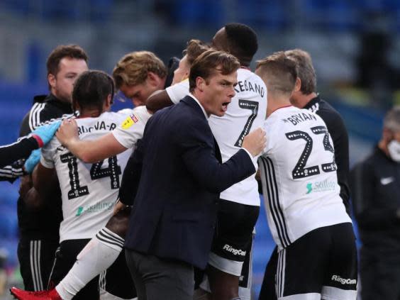 Scott Parker, manager of Fulham, celebrates with is players (Getty Images)