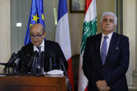 French Foreign Minister Jean-Yves Le Drian, left, and his Lebanese counterpart Nassif Hitti, hold a news conference following their meeting at the Lebanese foreign ministry in Beirut, Lebanon, Thursday, July. 23, 2020. Le Drian met with Lebanon's president Thursday at the start of his two-day visit to the Mediterranean country that is witnessing the worst economic crisis of its modern history. (AP Photo/Bilal Hussein)