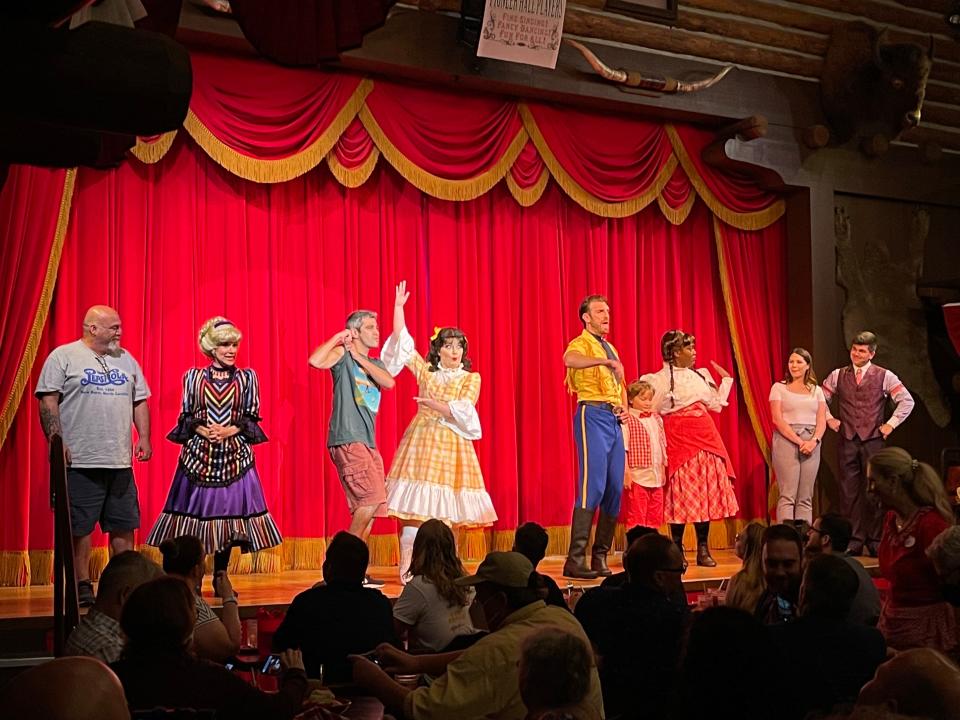 Hoop-De-Doo Revue at Disney performers on stage in front of red curtain