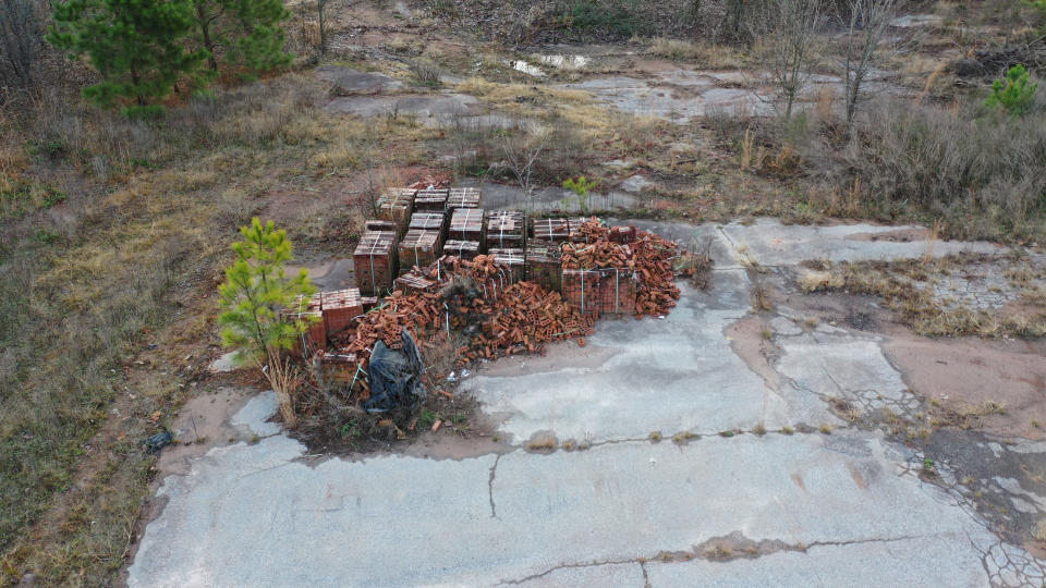 In this photo taken by a drone, and provided by Elliott Augustine, a pile of bricks lies on the site of the Chattahoochee Brick Company, in Atlanta, on Dec. 20, 2021. Atlanta was built with slavery’s successor: convict labor, enduring whippings and other atrocities while producing hundreds of thousands of bricks a day at the company owned by former Confederate Army captain and Atlanta Mayor James W. English. (AP Photo/Elliott Augustine)
