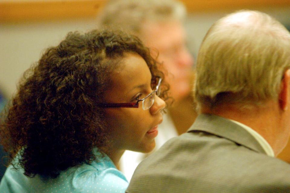 Carissa McGee, 17, left, talks Monday, July 16, 2007, with her attorney Rory Rank in District Court in Las Cruces.  McGee, a former Mayfield High School standout basketball player, listened in court as her mother and sister described how they were stabbed repeatedly by the one-time college basketball prospect. McGee entered no-contest pleas to two counts each of attempted first-degree murder and aggravated battery against a household member.