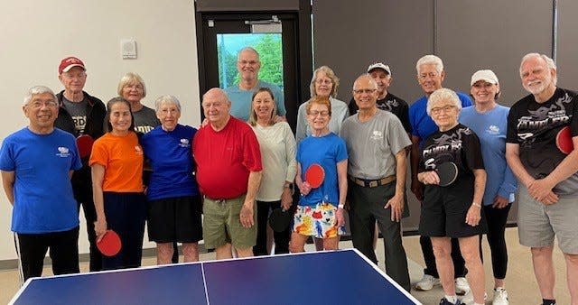 All 16 participants in the mixed doubles table tennis tournament.