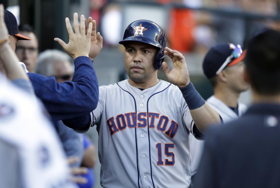 FILE - In this Saturday, July 29, 2017 file photo, Houston Astros designated hitter Carlos Beltran is congratulated after scoring from first on a triple by Derek Fisher during the fourth inning of a baseball game against the Detroit Tigers in Detroit. A person familiar with the decision tells The Associated Press the New York Mets have decided to hire Carlos Beltrán as their manager. The person spoke on condition of anonymity Friday, Nov. 1, 2019 because the team has not made an announcement. (AP Photo/Carlos Osorio, File)