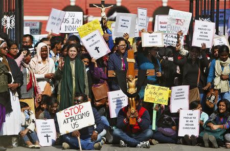 Demonstrators shout slogans as they hold placards during a protest outside a church in New Delhi February 5, 2015. REUTERS/Anindito Mukherjee