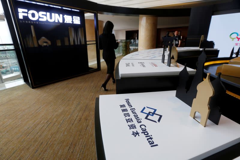 Fosun International Ltd services are displayed at a news conference in Hong Kong